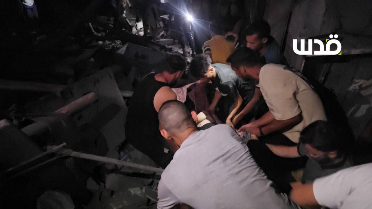 Trying to retrieve martyrs and searching for missing persons as a result of the bombing of the occup