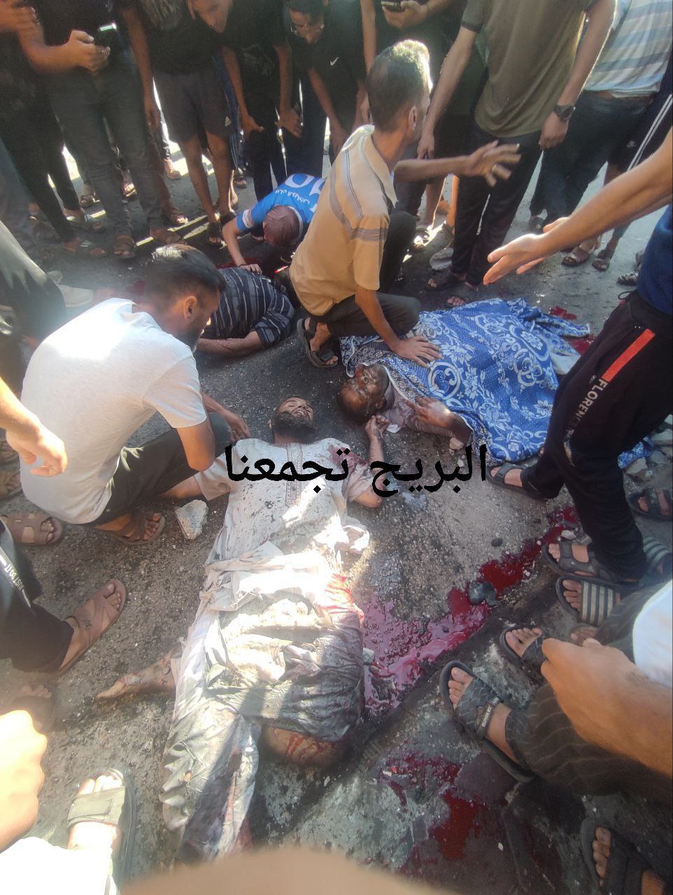 Shades martyrs at the place of targeting in Al -Bureij