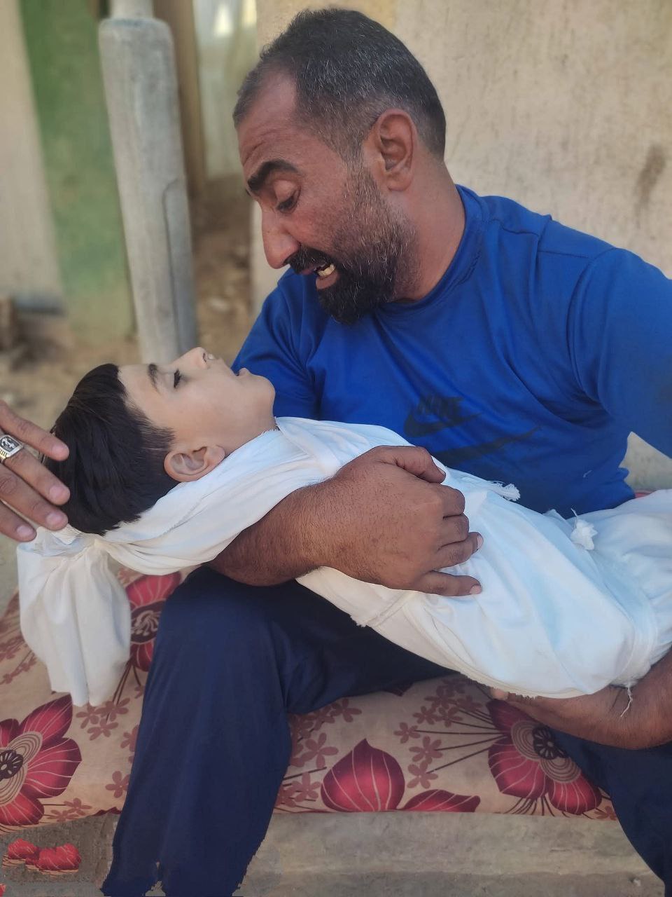 Tell me, your Lord, what this father feels, and he carries in his hands his only son from the childr