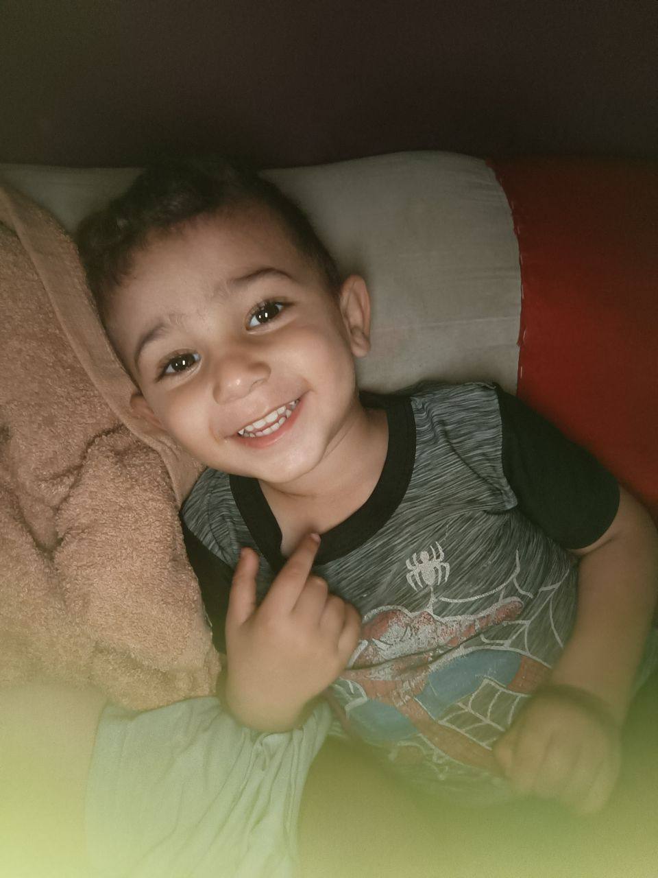 The loss of the child, Mohamed Ahmed Al -Zaig, wearing a blue blouse and a blue condition for the re