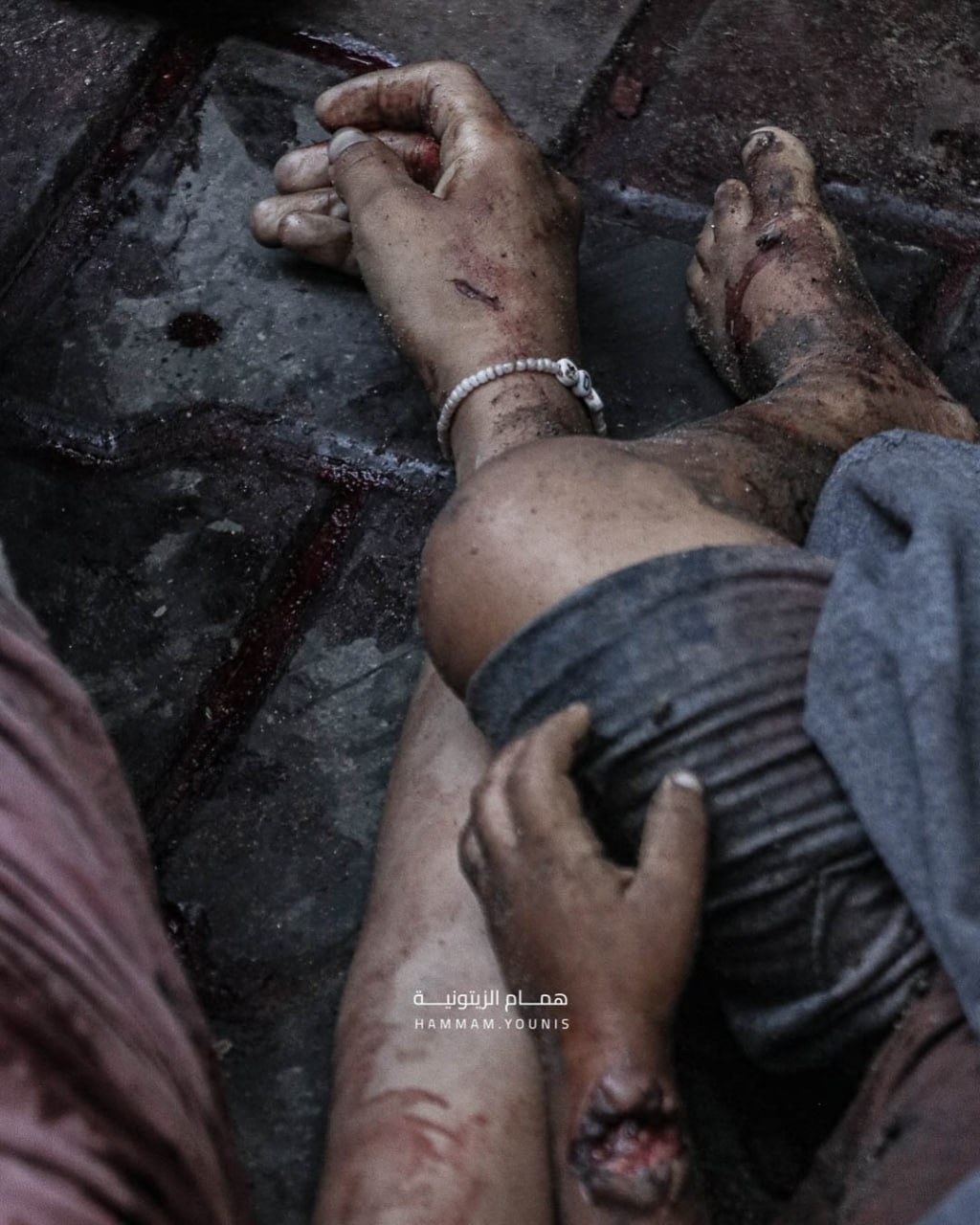 She holds her brother and bracelet in her hand a child who rose a martyr with her young brother in t
